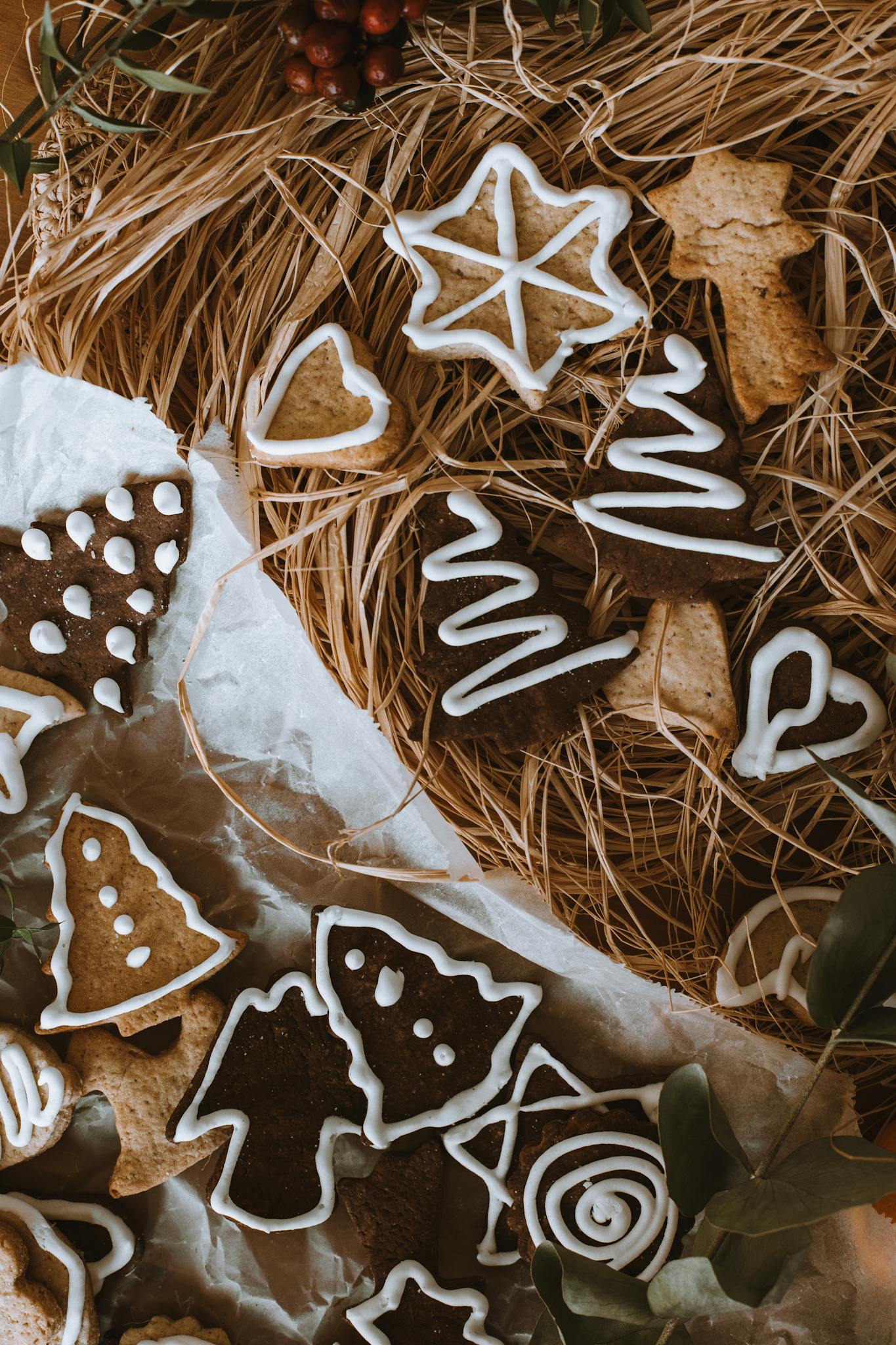An assortment of decorated gingerbread cookies in a rustic setting, perfect for a cozy Christmas atmosphere.